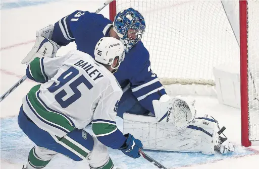  ?? STEVE RUSSELL TORONTO STAR ?? Maple Leafs goaltender Frederik Andersen robs the Canucks’ Justin Bailey from point-blank range in Monday night’s game at Scotiabank Arena.