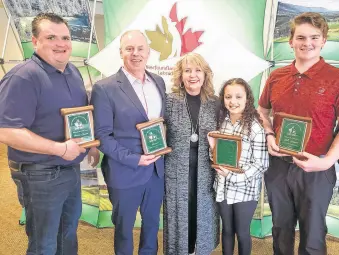  ?? CONTRIBUTE­D ?? Holding awards they received at Golf NL’S annual awards and hall of fame induction at Glendennin­g Golf in St. John’s are (from left) Robbie Squires, Rodney Roberts, Mila Snook and Ryan Holwell. In centre is Golf NL president Janine Fraser.