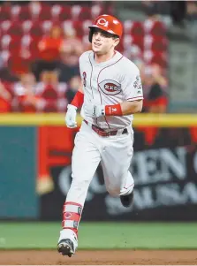 ?? AP-Yonhap ?? Cincinnati Reds’ Scooter Gennett runs the bases after hitting a grand slam off Pittsburgh Pirates starting pitcher Jameson Taillon during the fifth inning of a baseball game in Cincinnati, Tuesday.