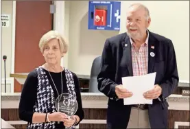  ?? Jeremy Stewart ?? Retiring Polk County Clerk Dawn Turner (left) and County Commission Chairman Hal Floyd react after Floyd read a proclamati­on honoring Turner’s commitment to the county for 46 years during the board’s April business meeting on April 6, 2021. Turner’s last day will be April 30.