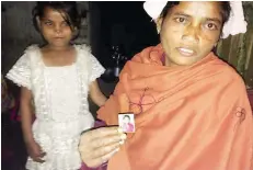  ?? — Reuters ?? Rukmani Naik of West Bengal state poses with a picture of her 14-year-old daughter who left their home in the Diana Tea Estate to work in another city.