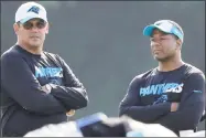  ?? Chuck Burton / Associated Press file photo ?? In this Aug. 3, 2015, file photo, Panthers head coach Ron Rivera, left, talks with assistant head coach Steve Wilks. The New York Giants interviewe­d Wilks for their vacant head coaching position on Tuesday.
