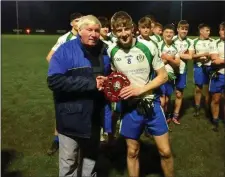  ??  ?? Mick Hagan presents Cian Cooney with the trophy.