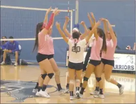  ?? STAFF PHOTO BY ANDY STATES ?? La Plata’s volleyball team celebrates after winning a point in the second set of its match with the visiting Calvert Cavaliers on Tuesday night. La Plata lost the match in four tight sets.