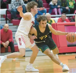  ?? KYLE TELECHAN/POST-TRIBUNE ?? Nate Lemmons, right, drives to the basket against Kankakee Valley’s Colton Pribyl.