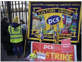  ?? (AP/Kirsty Wiggleswor­th) ?? A banner hangs outside the British Museum in London on Tuesday as university staff and civil servants went on strike as a wave of industrial action continues to sweep the United Kingdom.