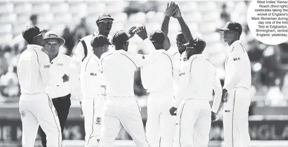  ??  ?? West Indies’ Kemar Roach (third right) celebrates taking the wicket of England’s Mark Stoneman during day one of the first Test at Edgbaston, Birmingham, central England, yesterday.