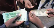  ?? TSVANGIRAY­I MUKWAZHI ?? ZIMBABWE’S central bank last month directed banks to separate foreign currency accounts from the surrogate bond note currency. | AP