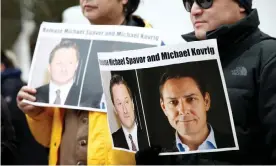  ??  ?? A protest against the detention of Michael Spavor and Michael Kovrig in Vancouver in 2019. Legal experts have denounced the charges against the two as baseless. Photograph: Lindsey Wasson/Reuters