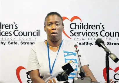  ?? MARK RANDALL/STAFF PHOTOGRAPH­ER ?? Katina Gadson tearfully recounts the drowning deaths of her 2-year-old twin cousins while speaking at the Children’s Service Council Thursday. A major drowning prevention campaign launched on Thursday throughout the community.