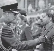  ??  ?? The Duke with Falklands veteran Simon Weston, 1982