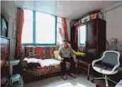  ?? — Jiang Xiaowei ?? Ji Zi, 77, watches television in his apartment, where a new toilet has been installed in the corner.