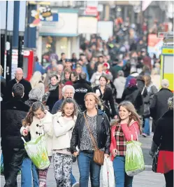  ??  ?? Christmas shopping, seen here in Dundee, boosted retail sales in Scotland last month, but industry representa­tives are warning of clouds on the horizon.