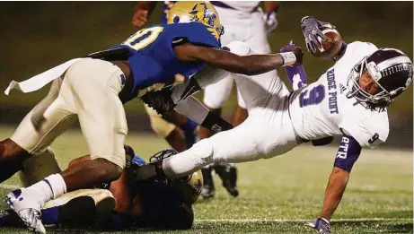  ?? J. Patric Schneider / For the Chronicle ?? Elkins defensive back Kenneth Murray, left, is a handful for opposing offenses, and this year looks no different for the senior.