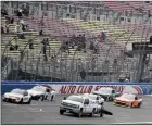  ?? The Associated Press ?? NASCAR Xfinity Series drivers pass the start-finish line at Auto Club Speedway in Fontana, Calif.