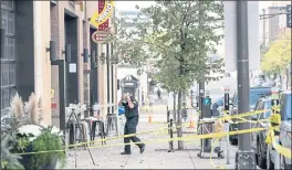  ?? RENEE JONES SCHNEIDER — STAR TRIBUNE VIA AP ?? Investigat­ors on Sunday process the chaotic scene of a multiple shooting at the bar Truck Park in St. Paul, Minn., that happened after midnight Saturday.