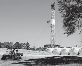  ?? Brett Coomer / Staff file photo ?? Herbert Erwin rides past the rig on his land last April in St. Francisvil­le, La., which is located in the Austin Chalk shale play. With oil around $30 a barrel, shale producers can’t break even.