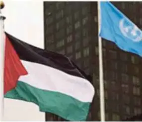  ??  ?? The Palestinia­n flag flies proudly next to the UN G-77 flag.