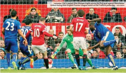  ?? REUTERSPIX ?? Leicester City’s captain Wes Morgan (right) scores the first goal against Manchester United during their English Premier League match at Old Trafford yesterday. –