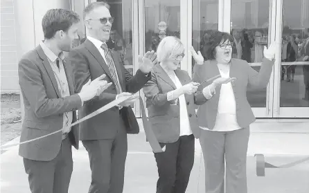  ??  ?? From left, Miramichi Mayor Adam Lordon, Liberal MP for Miramichi-Grand Lake Pat Finnigan, federal Public Services Minister Carla Qualtrough and New Brunswick Minister of Seniors and Long-Term Care Lisa Harris take part in a ribbon-cutting ceremony to...