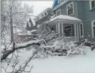  ??  ?? This photo by Miguel Tomas shows a downed tree on Broad Street in Oneida on Friday, March 2, 2018.