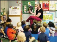  ?? AP PHOTO/ROSS D. FRANKLIN ?? Kindergart­en teacher Lynola Vis reads a book in class at Phoenix Christian School PreK-8 in Phoenix on Oct. 25.