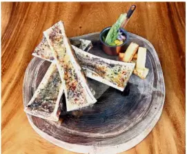  ??  ?? Forget about your diet and just focus on how good the fat-laden rubia Gallega bone marrow is as you savour each mouthful.