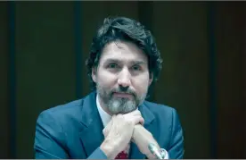  ?? The Canadian Press ?? Prime Minister Justin Trudeau listens to a question during a year end interview with The Canadian Press in Ottawa