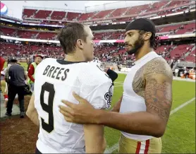  ?? D. ROSS CAMERON — THE ASSOCIATED PRESS ?? In this Nov. 6, 2016, photo, 49ers quarterbac­k Colin Kaepernick is greeted by Saints quarterbac­k Drew Brees at the end of a game.
