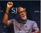  ?? ASSOCIATED PRESS FILE PHOTO, 2018 ?? John Carlos raises his fist as he speaks about his experience as an Olympian who participat­ed in the 1968Mexico City Games.