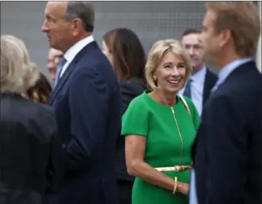  ?? CORY MORSE — THE GRAND RAPIDS PRESS VIA AP ?? U.S. Education Secretary Betsy DeVos arrives at the dedication ceremony of Michigan State University’s new Grand Rapids Medical Research Center on Wednesday in Grand Rapids, Mich.