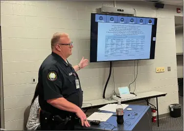  ?? (Arkansas Democrat-Gazette/Grant Lancaster) ?? Maj. Casey Clark, who leads Little Rock police’s Northwest Patrol Division, talks about criminal activity in that part of the city and his officers’ efforts to reduce it during a quarterly meeting Thursday at the division’s Kanis Road headquarte­rs.