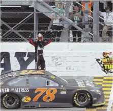  ?? AP PHOTO ?? TRUE CHAMPION: Martin Truex Jr. celebrates after winning yesterday’s NASCAR Monster Energy Series race at Chicagolan­d Speedway in Joliet, Ill.