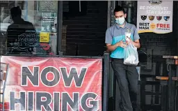  ?? LM OTERO/AP ?? A customer walks past a “Now Hiring” sign Sept. 2 at an eatery in Richardson, Texas.