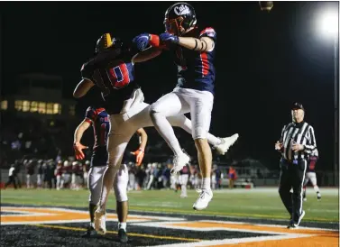  ?? SHAE HAMMOND — STAFF PHOTOGRAPH­ER ?? North's Jackson Steffen, Mountain View, (10) and Quinn Merritt, of Los Gatos, (1) celebrate after scoring a touchdown against the South team in the fourth quarter of the Annual Charlie Wedemeyer High School Allstar Football Game at Los Gatos High School in Los Gatos on Feb. 5.