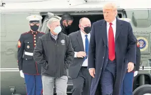  ?? ALEX BRANDON THE ASSOCIATED PRESS ?? President Donald Trump and Republican Sen. Lindsey Graham, left, walk to Air Force One Tuesday in Harlingen, Texas, after visiting a section of the border wall with Mexico in Alamo, Texas.