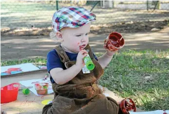  ??  ?? George Graham gets stuck into some paint at the picnic.