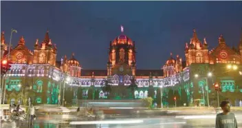  ?? — AFP ?? The Chattrapat­hi Shivaji Terminus railway station is lit in the colours of national flag ahead of the country’s Independen­ce Day in Mumbai on Monday.