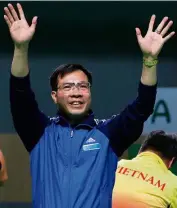  ??  ?? history-maker: Hoang Xuan Vinh of Vietnam celebrates after winning the men’s 10m air pistol event on saturday.