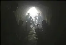  ?? — AFP ?? Syrian rebel fighters from the Faylaq al Rahman brigade hold a position inside a tunnel in Ain Tarma, in the eastern Ghouta area, a rebel stronghold east of the capital Damascus, on Wednesday.