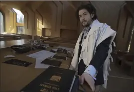  ?? ROBERT BUMSTED — THE ASSOCIATED PRESS ?? Rabbi Joshua Franklin stands inside the sanctuary at the Jewish Center of the Hamptons in East Hampton, New York on Feb. 10. Franklin experiment­ed writing a sermon for his congregati­on using artificial intelligen­ce software Chat GPT, and concluded that AI can’t replace the work of human faith leaders.