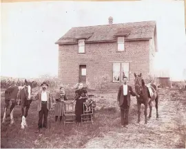  ?? COURTESY OF YOTT/ MOORE FAMILY ?? From left, Joseph Yott, 51, his daughter Mabelle Yott, 12, wife Augusta Yott, 51, son LeRoy Yott, 7, and son Frank Yott, 16, stand in front of the home he built for the family in the North Valley in 1894. The Yotts moved to New Mexico from Chicago...