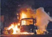  ?? PTI ?? The bus on fire after colliding with a truck on National Highway 24 in Bareilly.