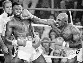  ?? The Associated Press file ?? Earnie Shavers’ powerful right hand knocked down heavyweigh­t champion Larry Holmes in a 1979 loss at Caesars Palace.