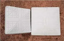  ?? ?? MLB increased the size of bases from 15 inches, pictured left, to 18 inches.