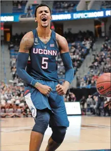  ?? JESSICA HILL/AP FILE PHOTO ?? UConn’s Vance Jackson reacts his dunk during the Huskies’ upset win over Houston in the American Athletic Conference tournament quarterfin­als on March 10 in Hartford. The 6-foot-8 freshman forward announced Tuesday that he was leaving the program after...