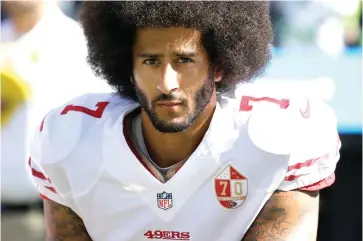  ?? Ted Warren/Associated Press file photo ?? ■ San Francisco 49ers quarterbac­k Colin Kaepernick kneels during the national anthem on Sept. 25, 2016, before a game against the Seattle Seahawks in Seattle. Kaepernick was a second-round draft pick in 2011 who the next year led the San Francisco 49ers to the Super Bowl. By 2016, he had begun kneeling on the sideline at games during the national anthem to protest social injustice and police brutality. Soon after, he was gone from the NFL, and he has not played since.