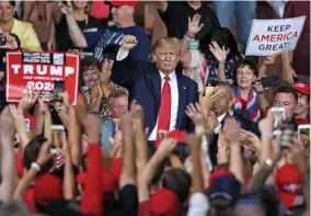  ?? MATT STONE / HERALD STAFF ?? GREAT DIVIDE: President Trump leaves after speaking at a rally at SNHU Arena on Thursday night in Manchester, N.H.