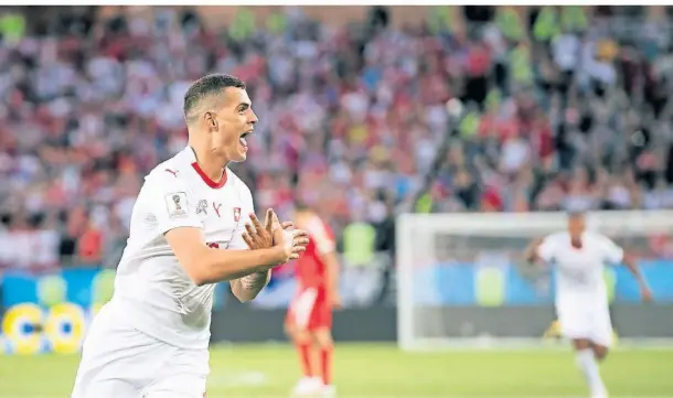  ?? FOTO: LAURENT GILLIERON/KEYSTONE/DPA ?? Dieser Jubel des Schweizers Granit Xhaka mit der Doppeladle­r-Geste sorgte bei der WM 2018 für Diskussion­en und eine Strafe.