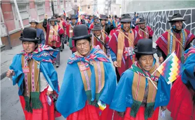  ?? Photo / AP ?? Indigenous Bolivians have taken to the streets of La Paz in support of Evo Morales.